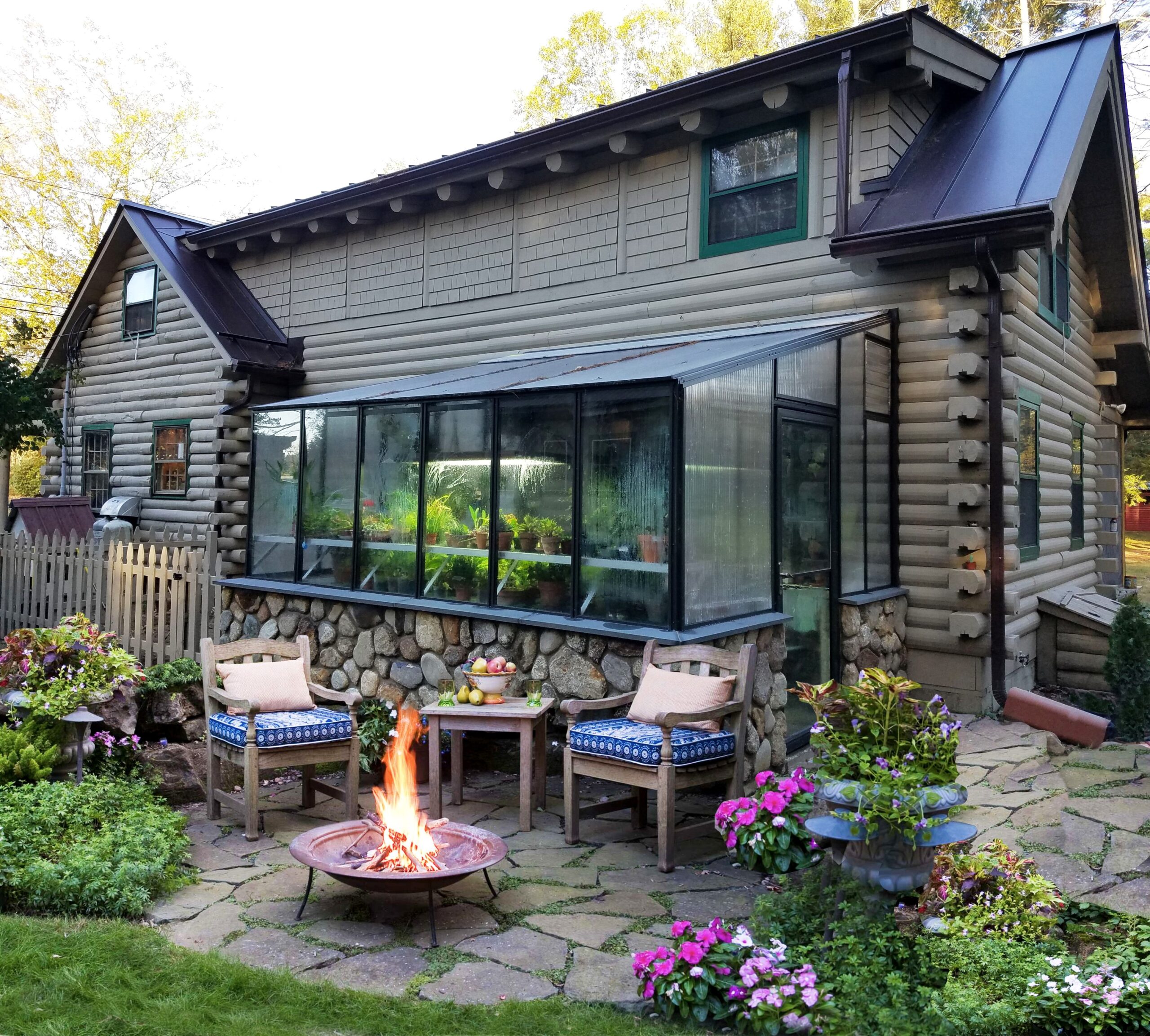 8x12 Arcadia GlassHouse lean-to greenhouse attached to a brick exterior wall